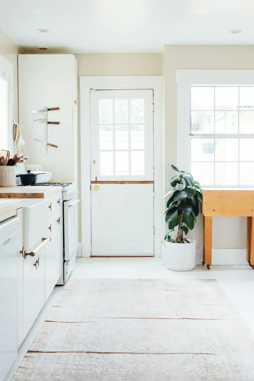 Bright minimalist kitchen remodel with warm finishes and natural light