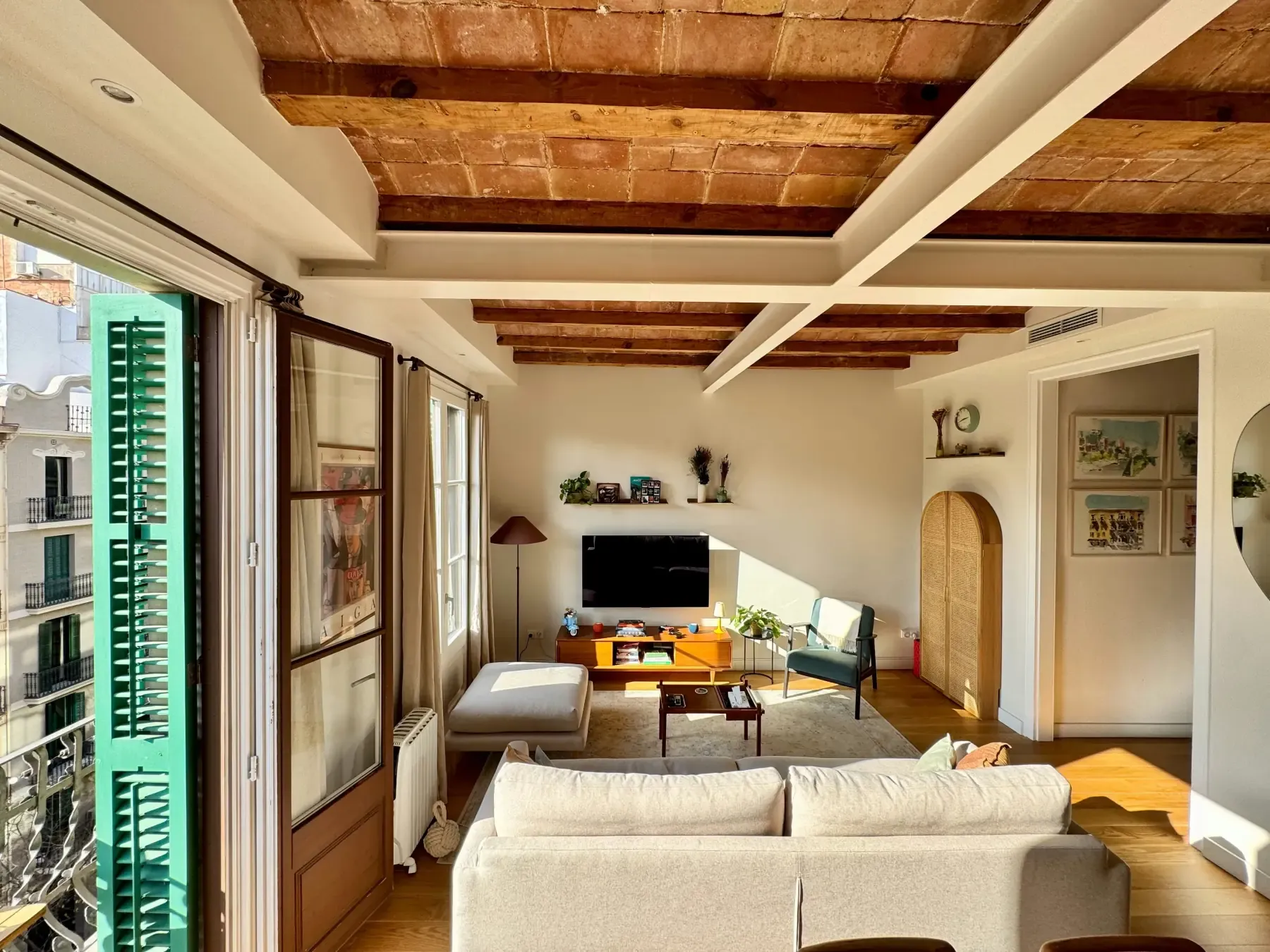 Cozy balcony addition with comfortable seating and greenery